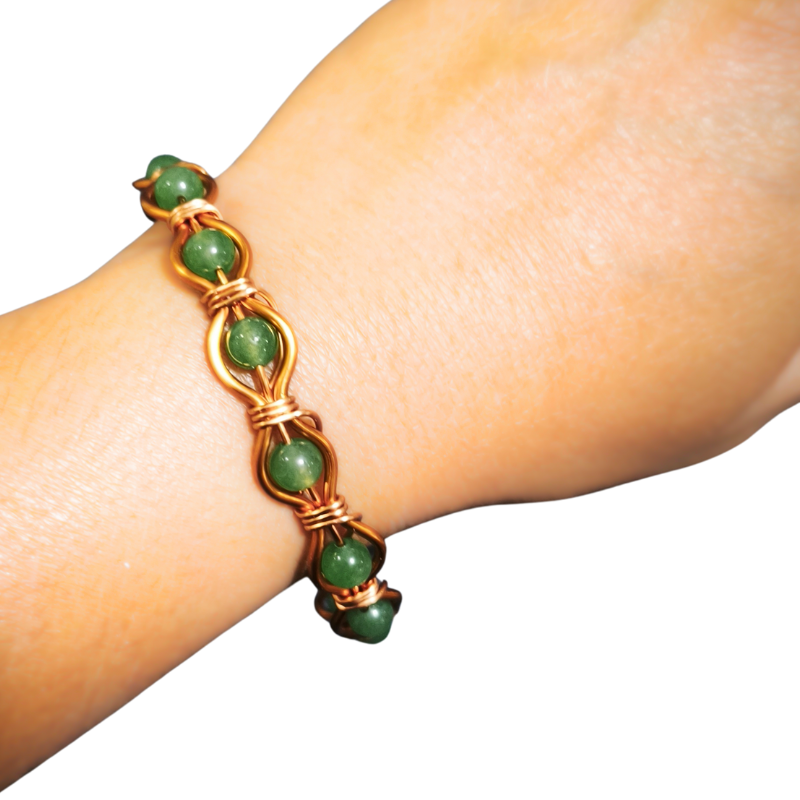 Radiant Twist Copper Bangle featuring Gemstones
