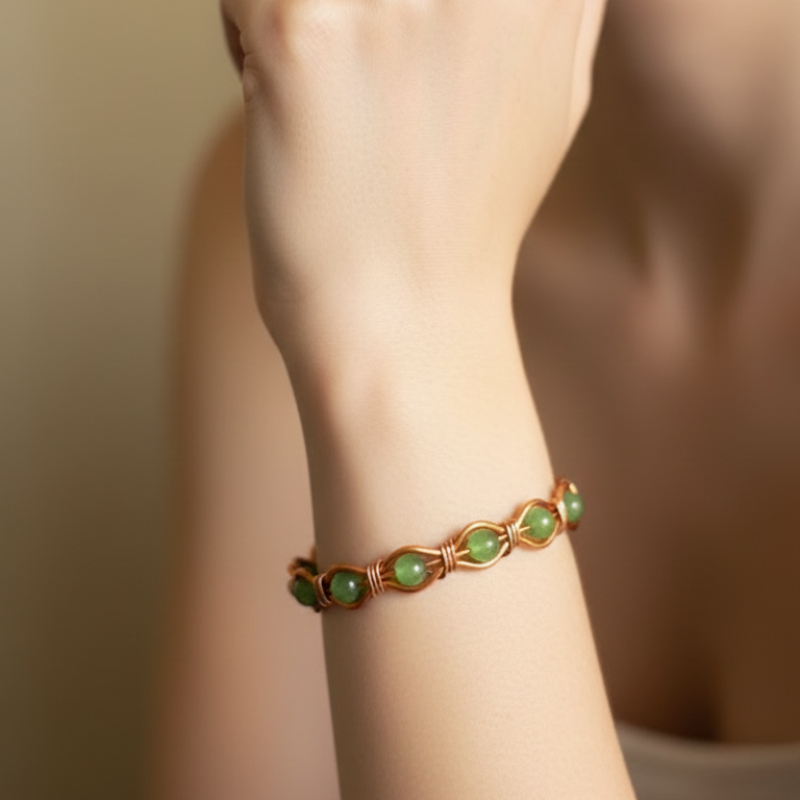Radiant Twist Copper Bangle featuring Gemstones