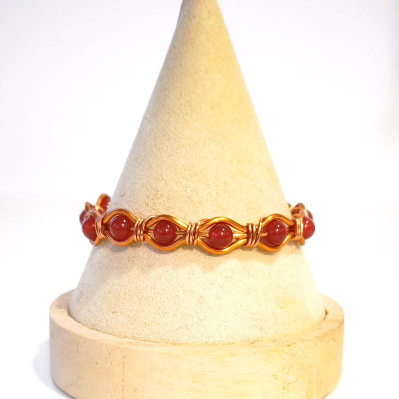 Radiant Twist Copper Bangle featuring Gemstones