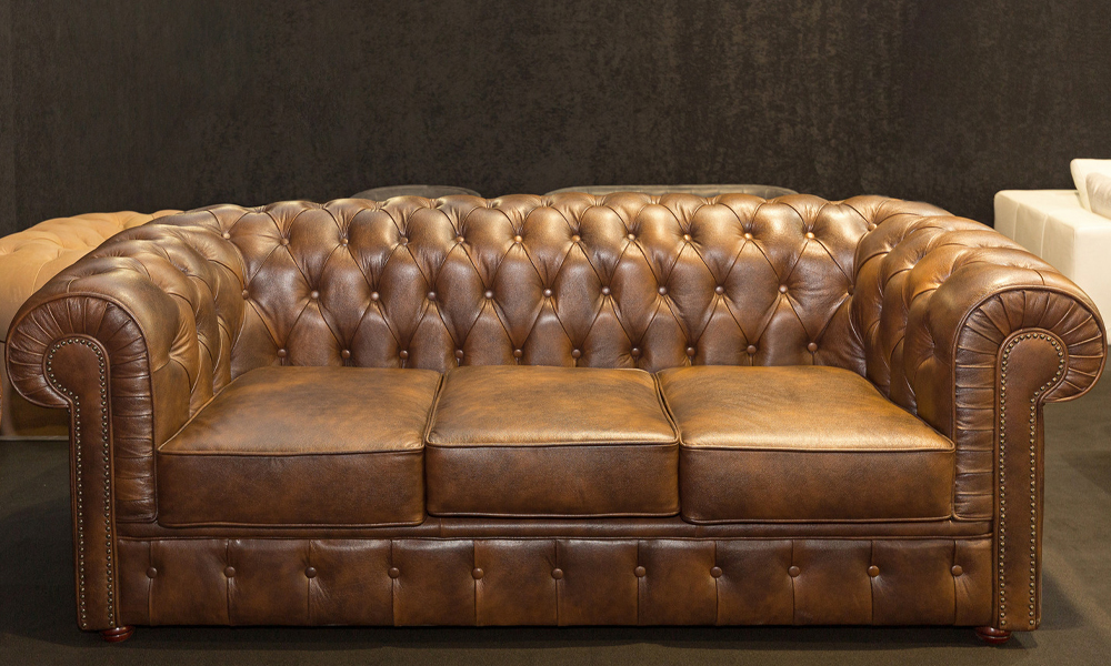 Dark brown leather chesterfield sofa