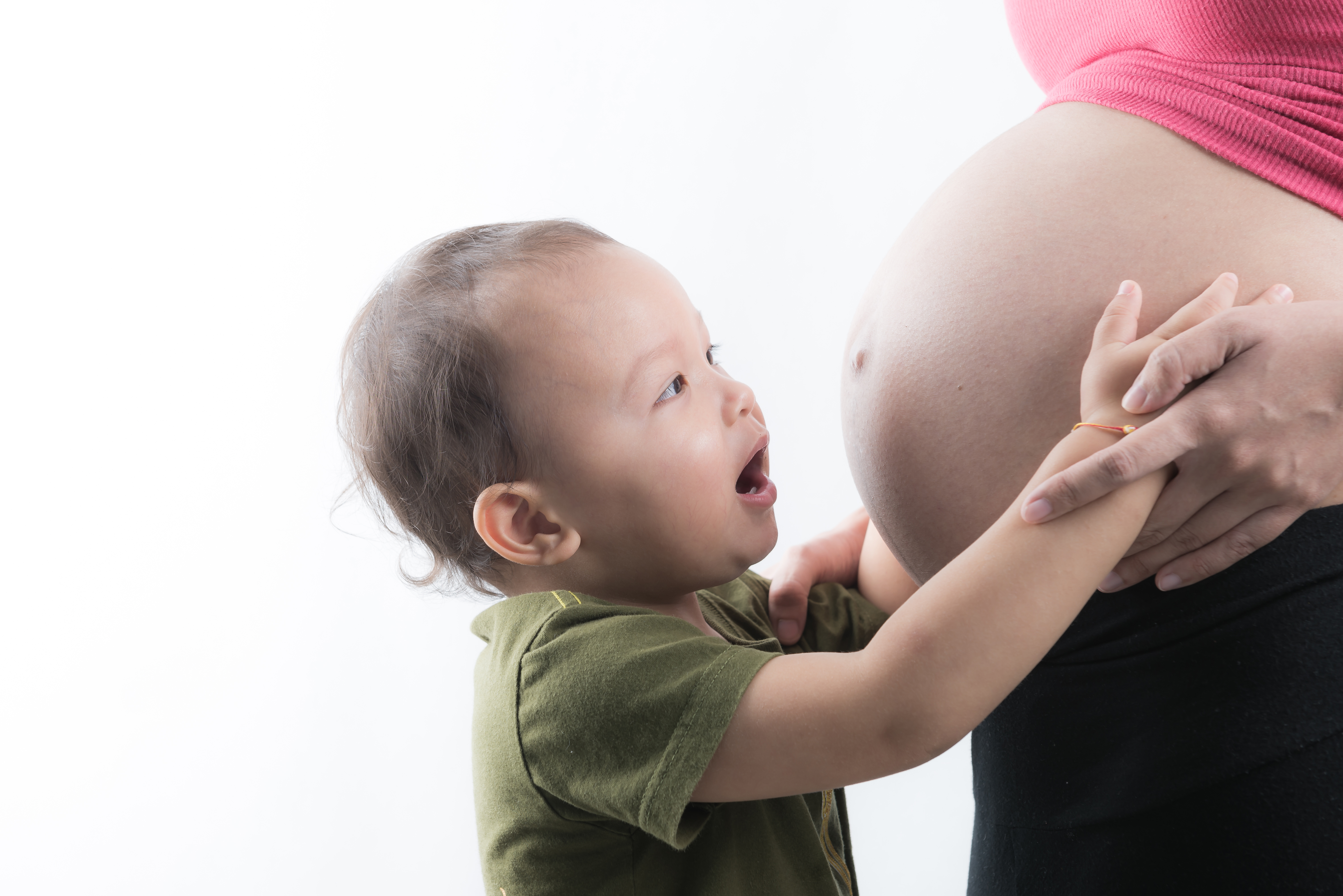 son-kiss-pregnant-woman