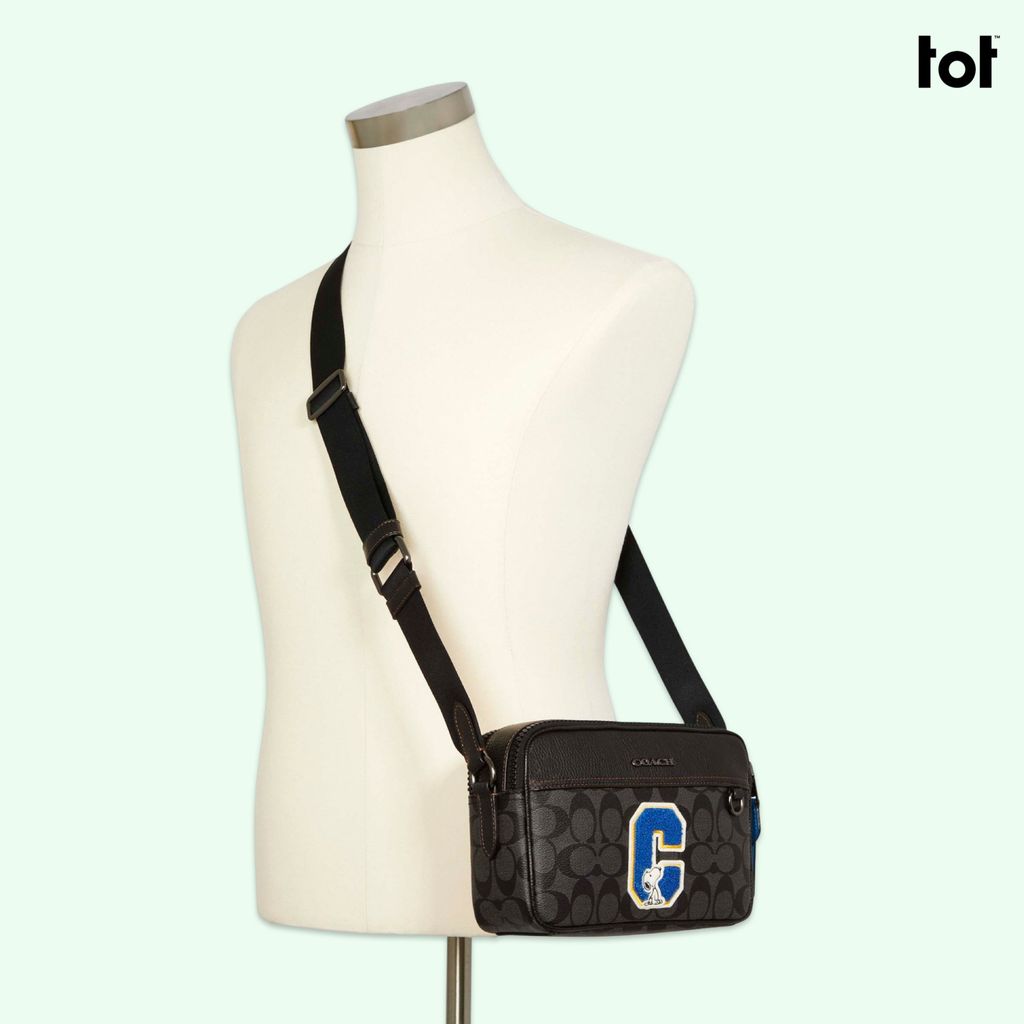 COACH X PEANUTS GRAHAM CROSSBODY IN SIGNATURE CANVAS WITH SNOOPY