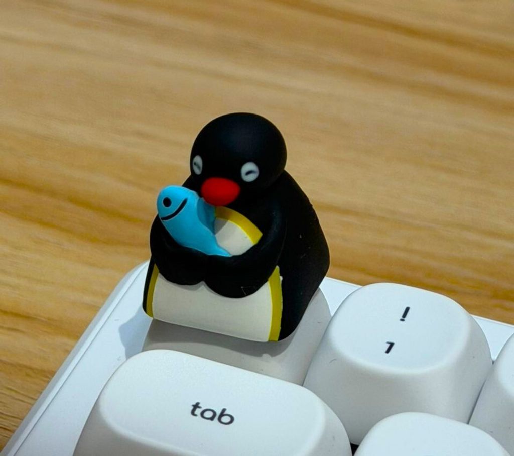 11. Penguin Holding Fish