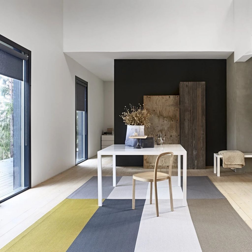 Fourways_two+rugs+side+by+side_Fourways+1403432_col.+brass-nutria_Fourways+1403001_col.+light+grey-white_paper+yarn_interior+2_woodnotes