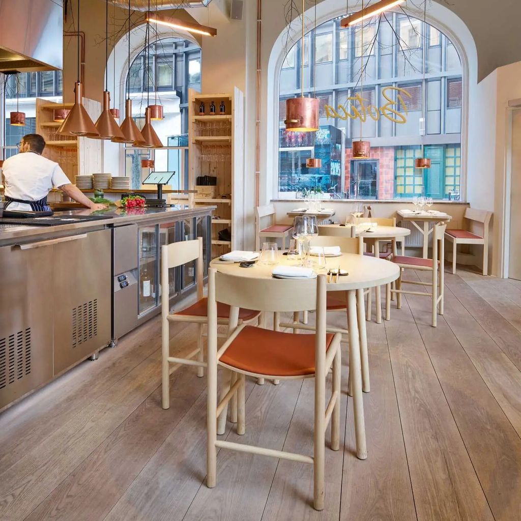 nikari-botica-akademia-upholstered-chair-skandi-table-ash-credit-Bjorn-Lofterud