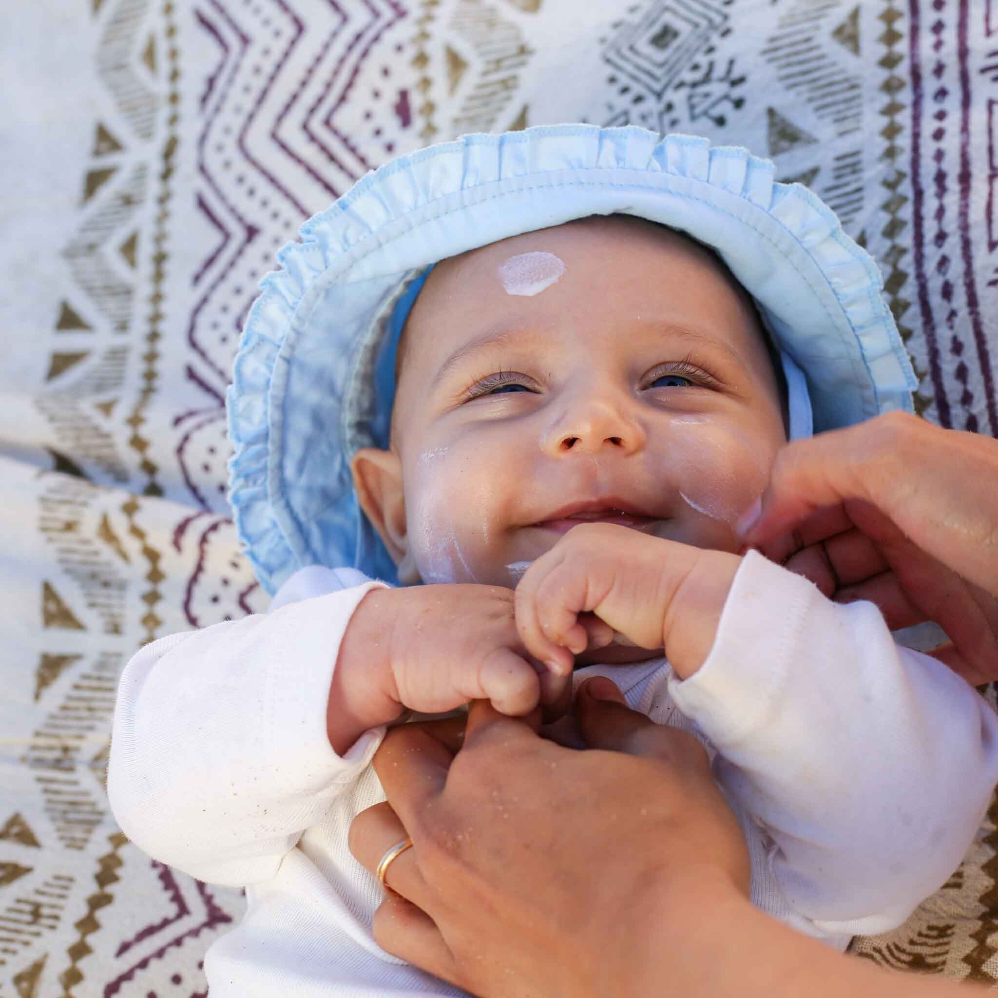 Kids Mineral Sunscreen SPF 30 - Man Applying Formula On Her Child On the Beach Happy - Suntribe Reef Safe Sunscreen-1