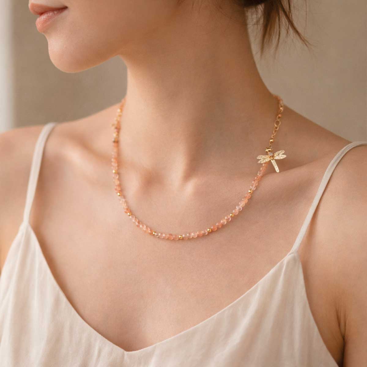 sunstone-dragonfly-necklace-side-wearing