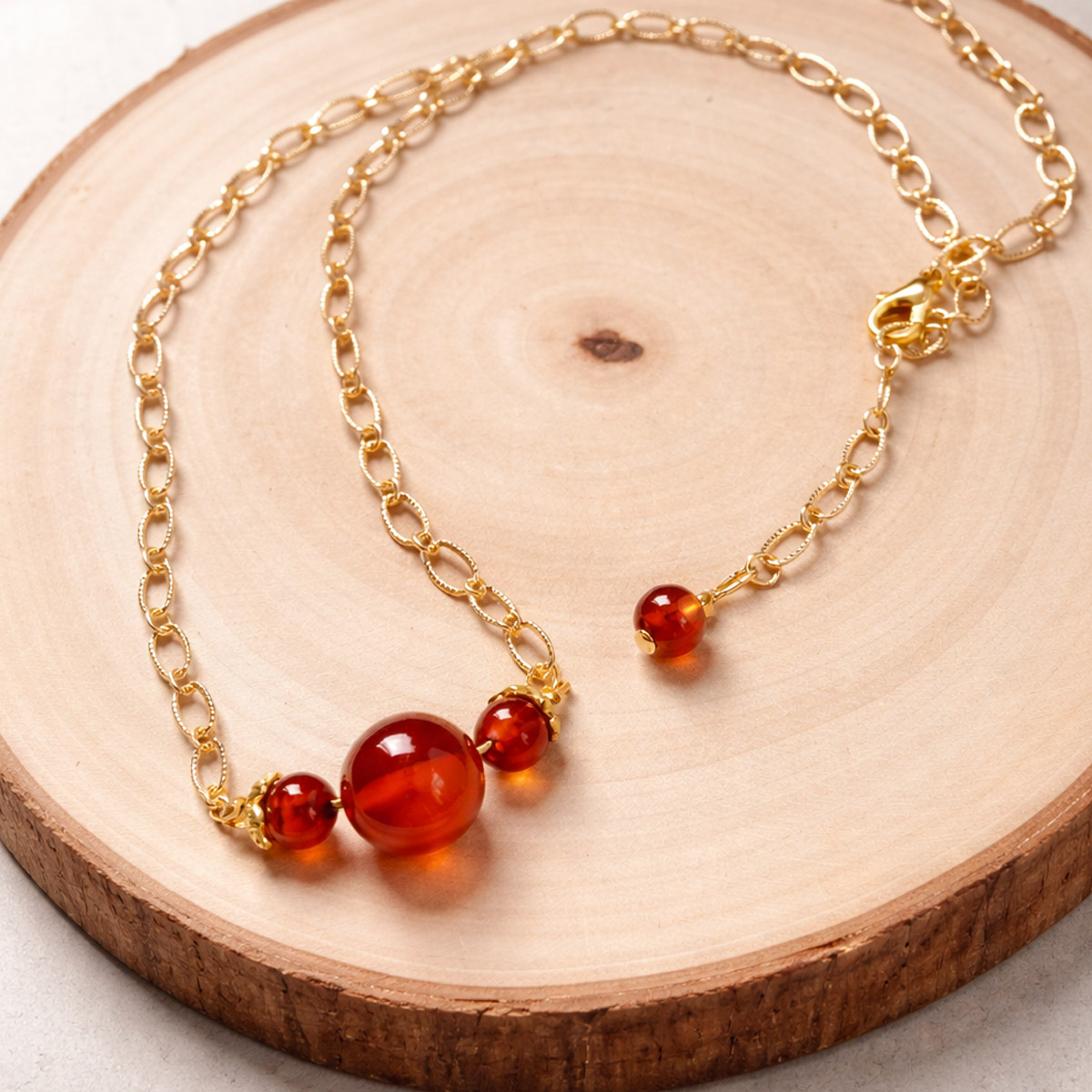 warm-red-agate-chalcedony-necklace-wood-background