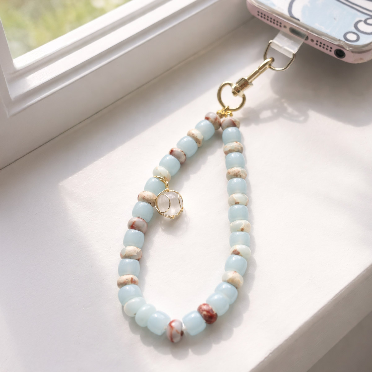 blue-opal-amazonite-phone-strap-window-light-scene