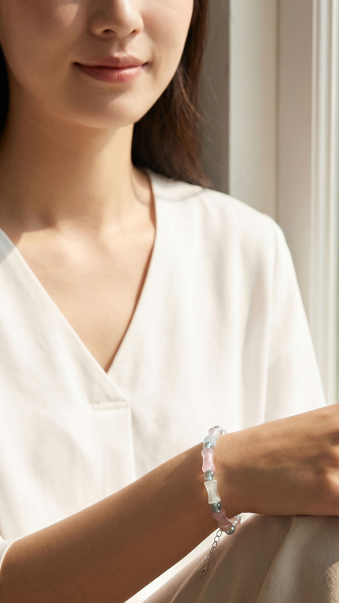 blue-apatite-segment-crystal-bracelet-wearing-window-light