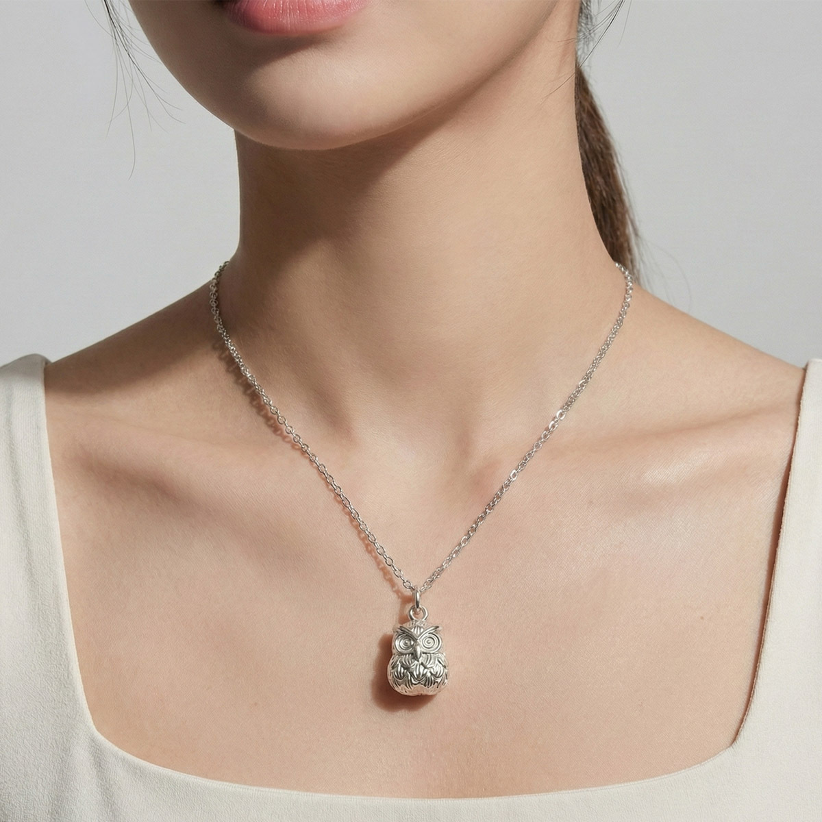 silver-owl-necklace-worn-model-soft-style