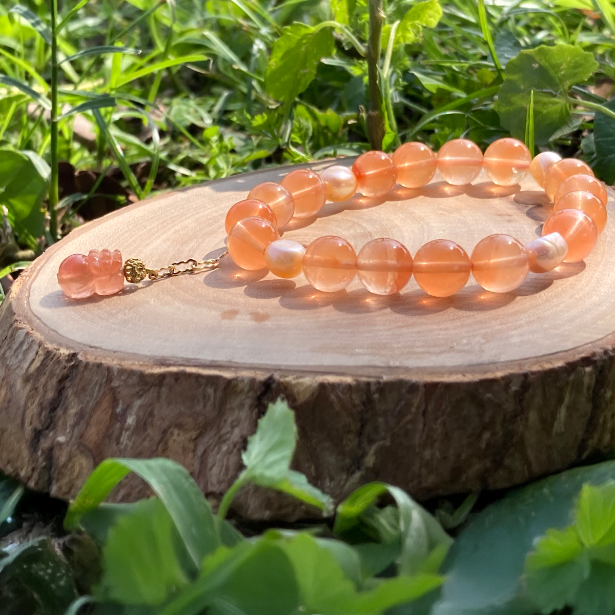 warm-orange-red-agate-pixiu-bracelet-natural-wood-outdoor