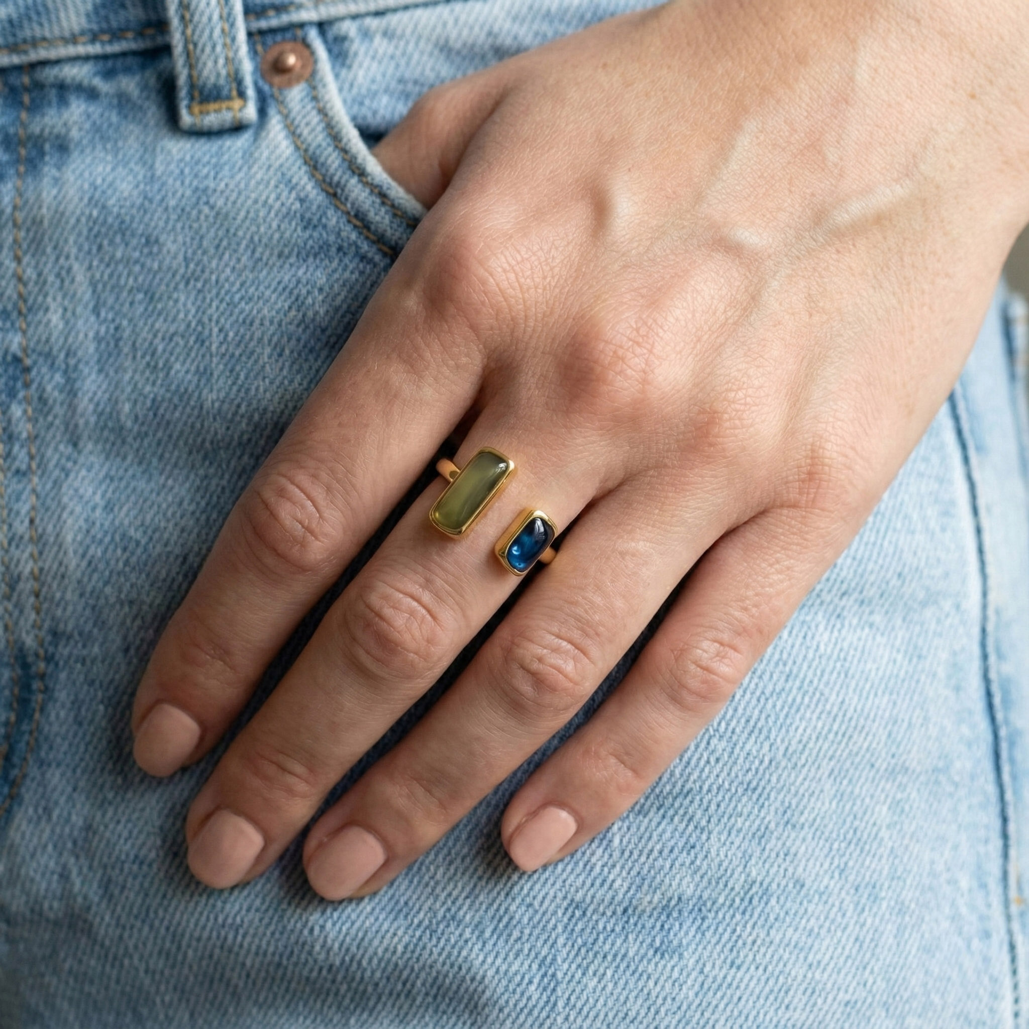 green-blue-dual-stone-open-ring-wearing-hand