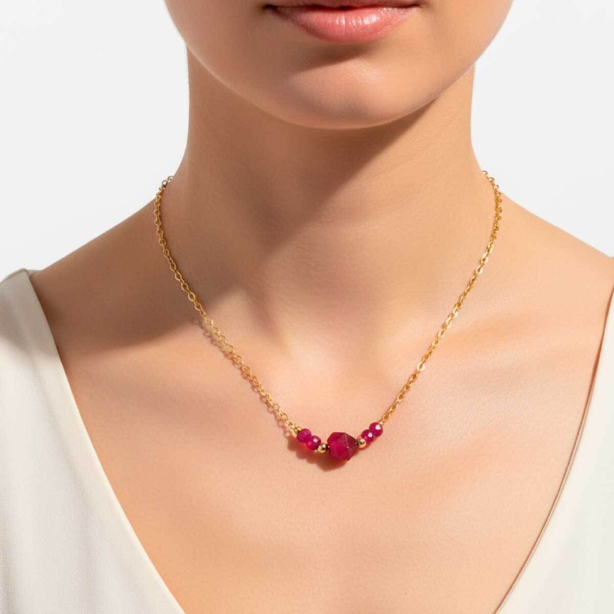 red-crystal-gold-chain-necklace-worn-on-model