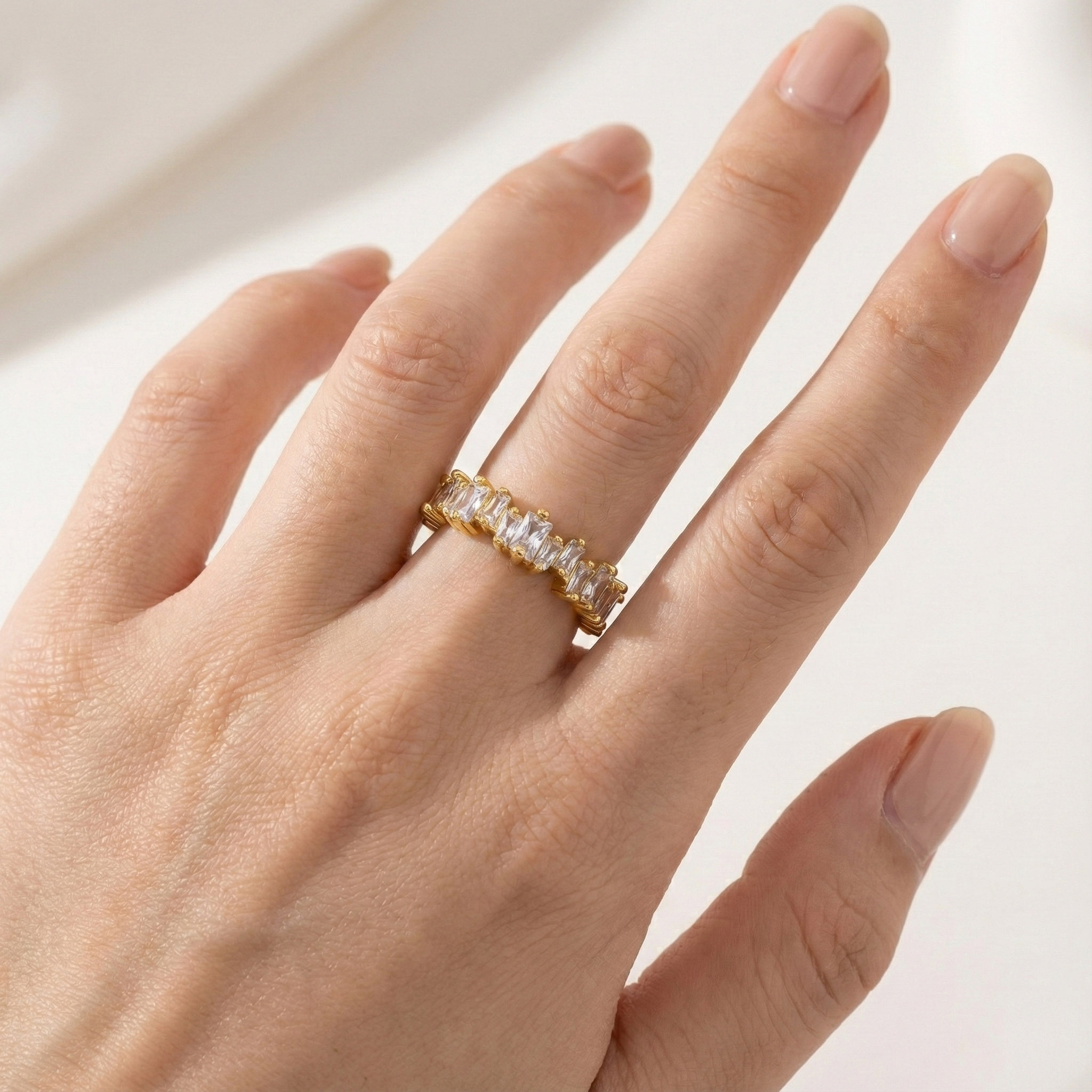 gold-prong-set-cubic-zirconia-ring-on-hand