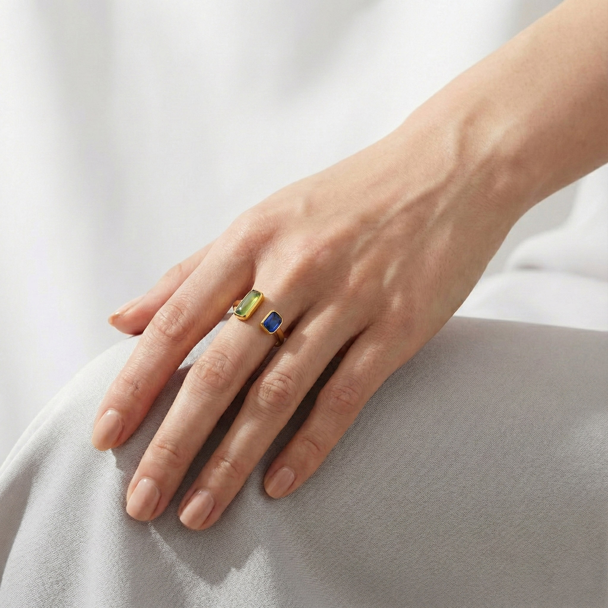 green-blue-dual-stone-open-ring-soft-light-wearing