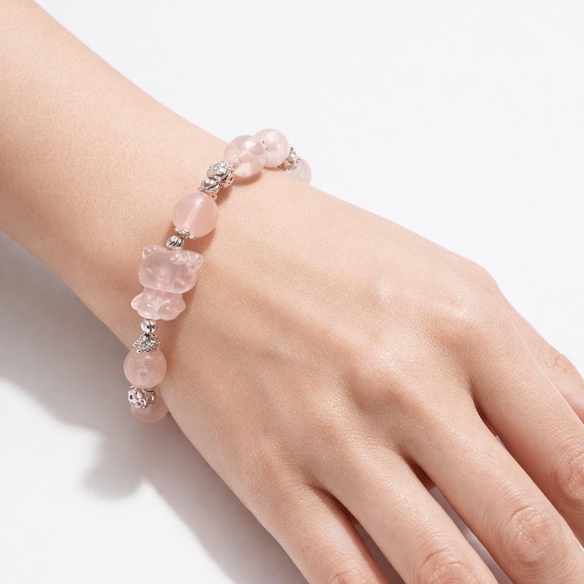 kitty-rose-quartz-bracelet-wearing-hand
