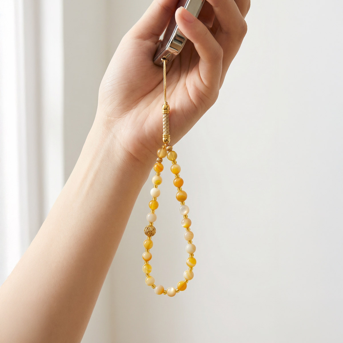 yellow-shell-jade-phone-strap-handheld-use