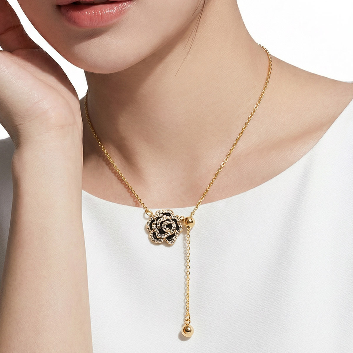 black-rose-minimal-drop-necklace-wearing-white-background