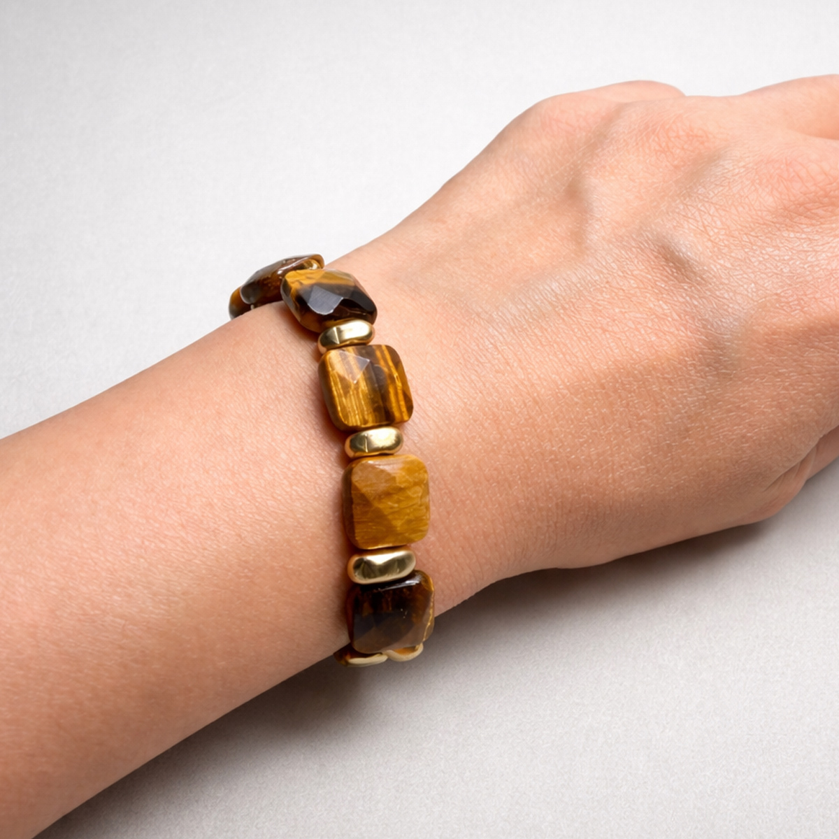 tigers-eye-amber-glow-bangle-on-wrist-closeup