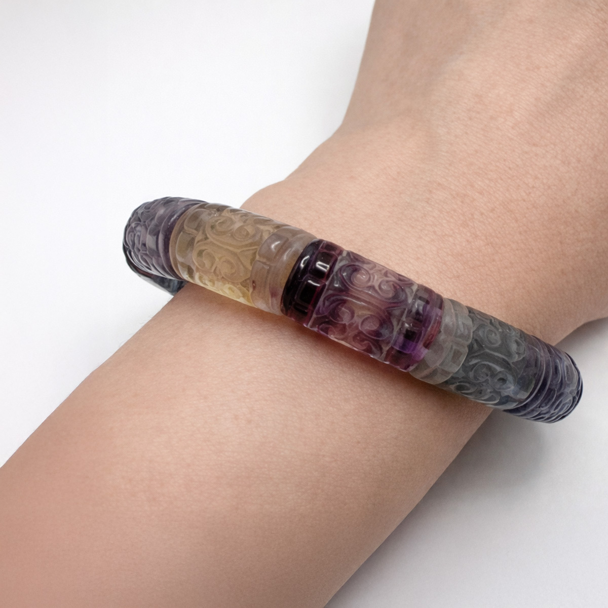 rainbow-fluorite-carved-bracelet-wrist-detail