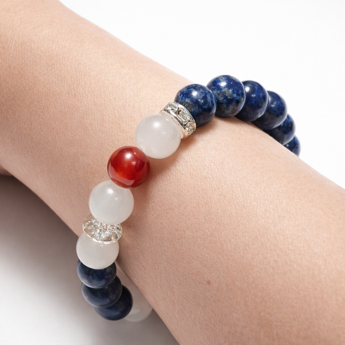lapis-lazuli-belief-rhythm-crystal-bracelet-on-wrist-red-bead-closeup