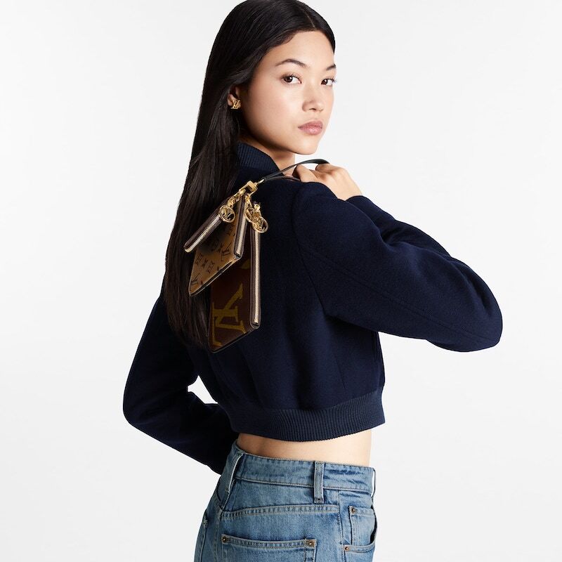louis-vuitton-trio-pouch-wallets-and-small-leather-goods--M68756_PM1_Cropped20worn20view2