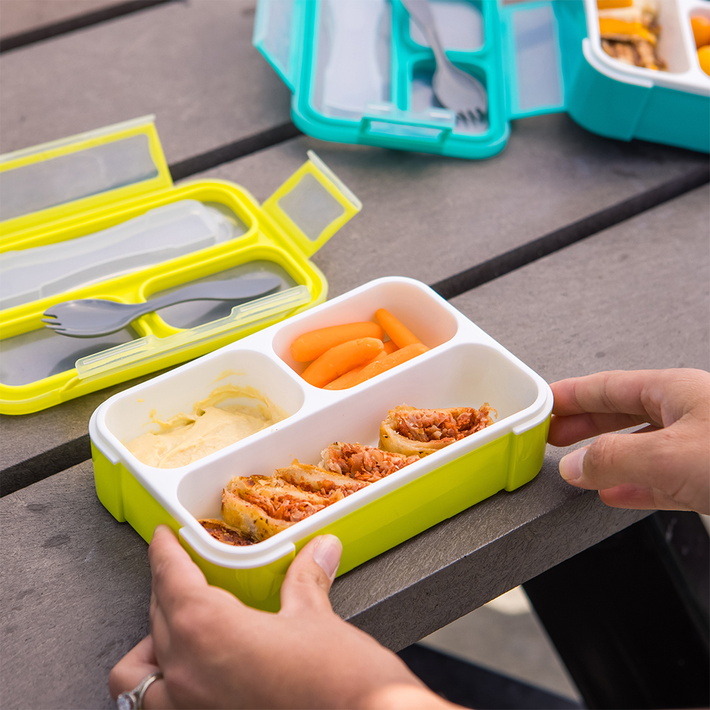 B0123_-_Bento_-_Lifestyle_-_Opened_Green_Lunchbox_with_food_-_Hands_holding_Bento_-_Square_Format