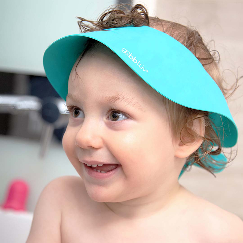 B0109A-_KAP_-_Child_smiling_with_cap_on_head