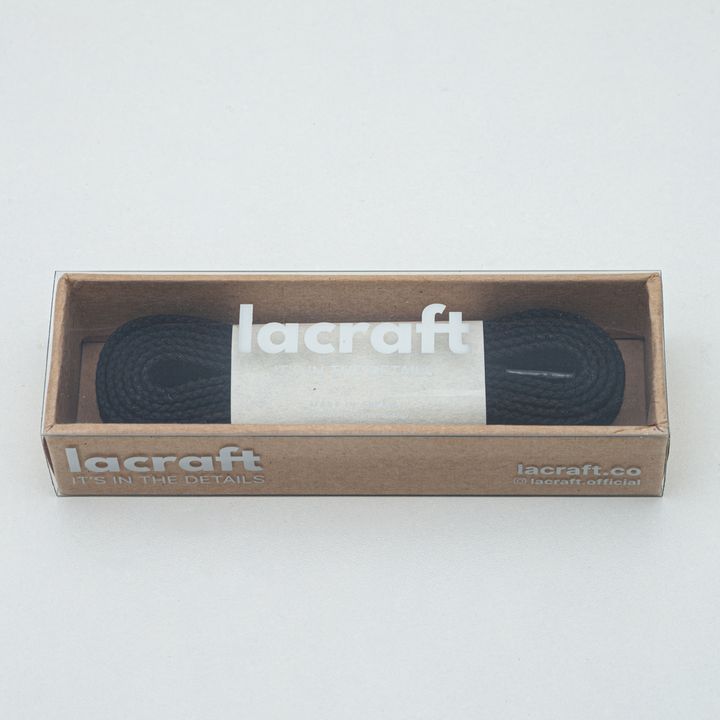 Solid black shoelace in box