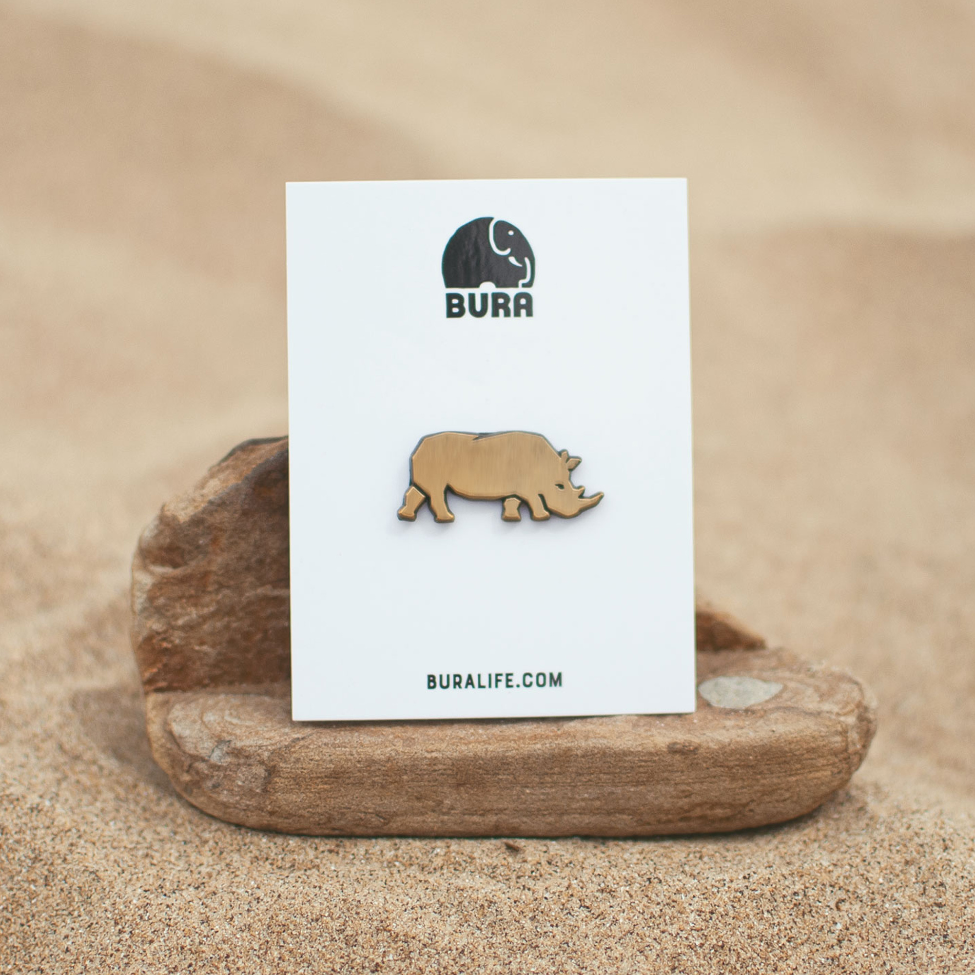 BURA gold enamel rhino pin brooch