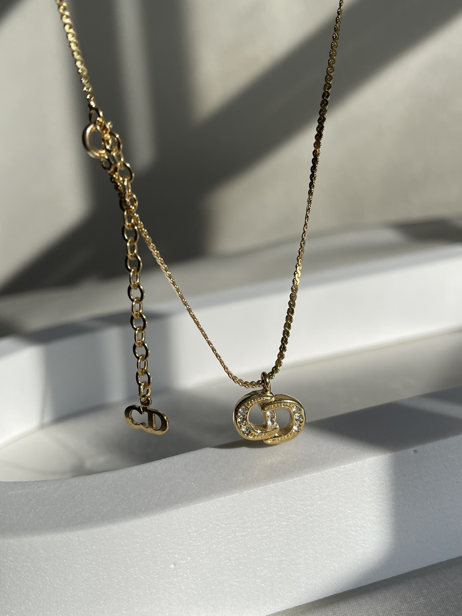 Christian Dior 1980s Gold CD Logo Necklace · INTO